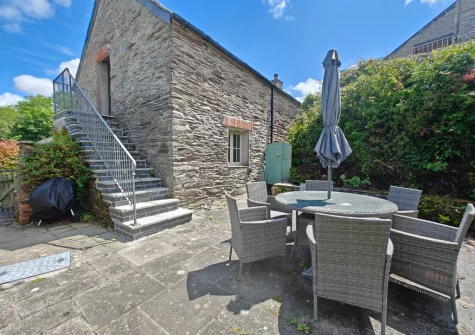 The enclosed patio, barbecue & alfresco dining area at The Long Barn, St Ervan