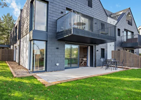 The patio, alfresco dining area &  enclosed lawn at The Longstore, Padstow