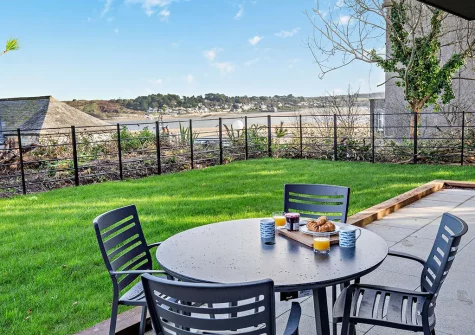 The patio, alfresco dining area &  enclosed lawn at The Longstore, Padstow