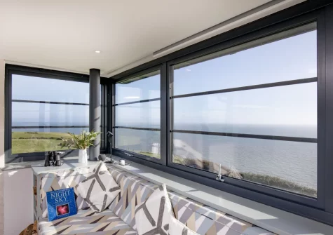 The living room, offers exceptional views with wonderful sunrises & magical sunsets, at The Lookout Tower, Beer