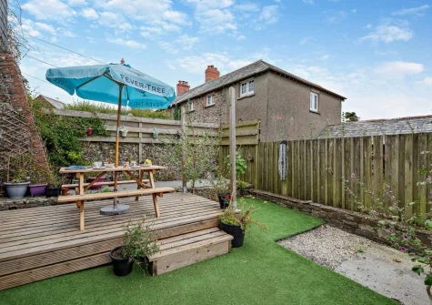 The decked patio, alfresco dining area & garden at The Martyn Rooms, Morwenstow