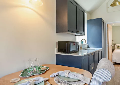 The dining area & kitchen at The Meeting Room, Beer