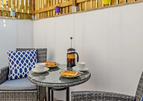 The enclosed courtyard & outdoor sitting area at The Meeting Room, Beer