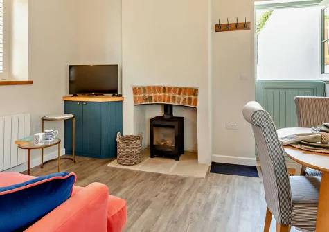 The Meeting Room, Beer, is a romantic single-storey barn conversion just 300 metres from the beach. Enjoy a characterful vaulted open-plan living space, sun-drenched courtyard, and the very best of East Devon's stunning coast and countryside.