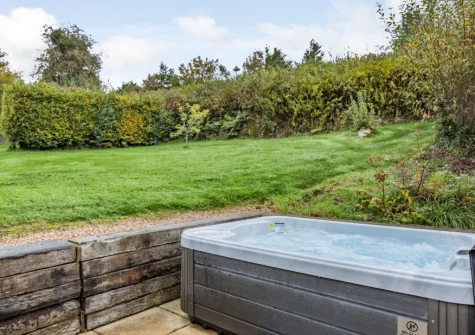 The patio & hot tub at The Milking Shed, Bittadon