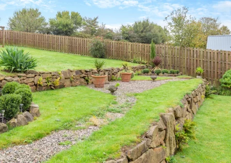 The large enclosed lawned garden at The Moohey, Downderry