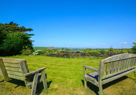Gaze out across the serene countryside to the distant sea views when you stay at The Mount, Crugmeer