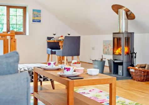 The living & dining area at The Nook, Trebudannon