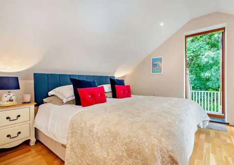 The bedroom at The Nook, Trebudannon