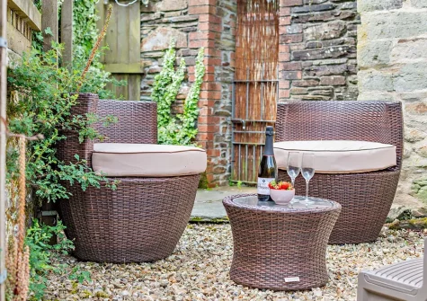 The courtyard & outdoor sitting area at The Nook, Trebudannon