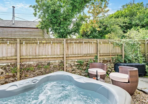 The hot tub & outdoor sitting areaat The Nook, Trebudannon