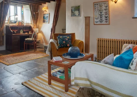 The North Wing at Trevigue, Crackington Haven is a charming one-bedroom farmhouse retreat with a private cobbled courtyard, cosy wood burner, and stunning coastal walks just moments from your door, perfect for a peaceful Cornish escape.
