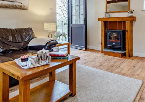 The Nuthatch, Higher Clovelly is a characterful stone barn conversion set in eight acres of peaceful grounds with its own lake, combining rural tranquillity with exposed beams and modern comfort, just moments from North Devon's dramatic coast.