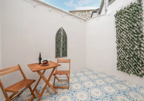 The Mediterranean-style courtyard & outdoor sitting area at The Old Bakery, Newlyn