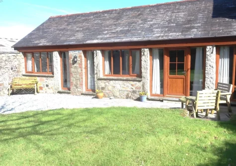 The patio, outdoor sitting area & enclosed garden at The Old Cart House, Lanivet