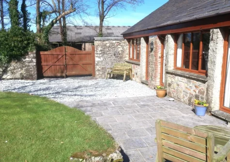 The patio, outdoor sitting area & enclosed garden at The Old Cart House, Lanivet
