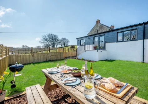 The barbecue, alfresco dining area & enclosed garden at The Old Cattle Shed, Altarnun