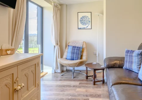The Old Cattle Shed, Altarnun is a beautiful single-storey retreat on the edge of Bodmin Moor, featuring contemporary interiors within historic stone walls, an enclosed garden with woodland views, and exceptional dark skies perfect for stargazing.
