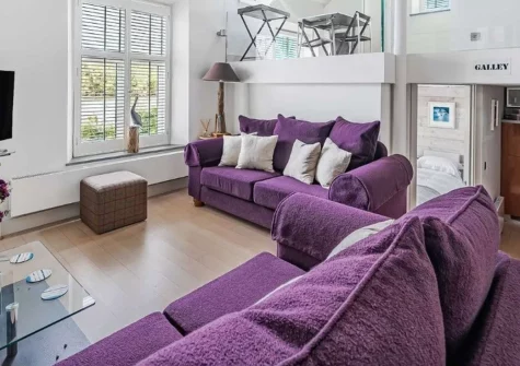 The Old Chapel, Malpas is a romantic riverside retreat for two, offering breathtaking Malpas River views, charming nautical interiors, a mezzanine dining space, and easy access to local pubs, cozy caf&eacute;s and scenic riverside walks close by.