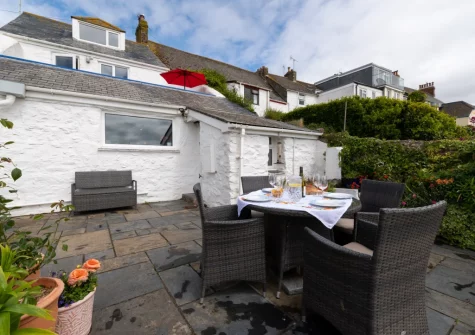 The patio & alfresco dining area at The Old Cowshed, Marazion