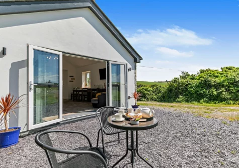The patio & outdoor sitting area at The Old Duck House, Porthcothan