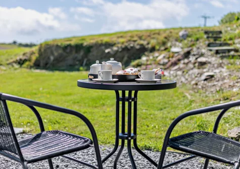 The patio & outdoor sitting area at The Old Duck House, Porthcothan