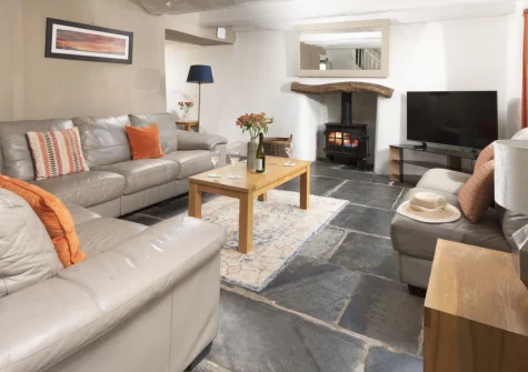 The Old Farmhouse, Trefanny Hill is a luxurious four-bedroom Cornish retreat with a private hot tub, alfresco dining area, wood burning stoves and 34 acres of countryside to explore, ideal for family holidays with well-behaved dogs warmly welcomed.