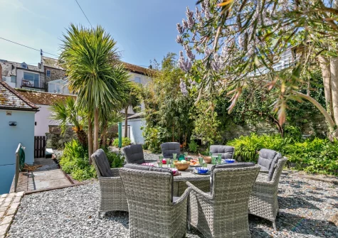 The alfresco dining area & Mediterranean-inspired enclosed garden at The Old Library, Fowey