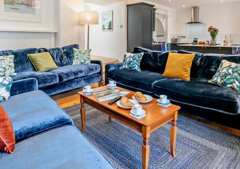 The Old Library, Fowey is a magnificent double-fronted Georgian townhouse in the heart of this celebrated harbour town, featuring elegant period details, a Mediterranean-inspired garden sanctuary, and just moments from the bustling quayside.