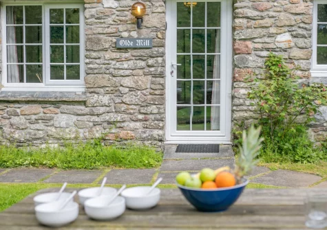 The shared lawned garden & alfresco dining area at The Old Mill Cottage, Advent