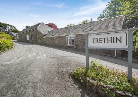 The Old Mill Cottage is a converted stone barn on the grounds of a 16th-century manor house