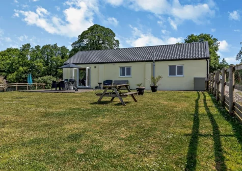 The enclosed rear garden at The Old Shippon has spectacular views across the rolling countryside