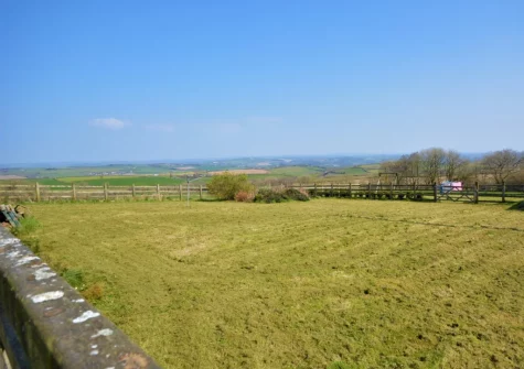 The large enclosed lawn, with summer house & garden furniture, at The Old Stables at Luppincott, Alverdiscott