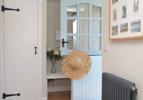 The entrance hallway hallway with coat & boot storage and utility cupboard, at The Old Stables, Braunton