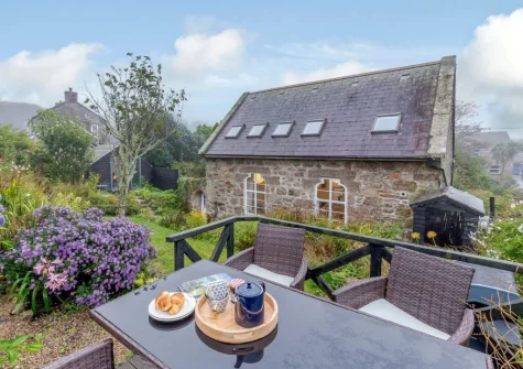 The decked patio, alfresco dining area & garden at The Old Sunday School, St Just