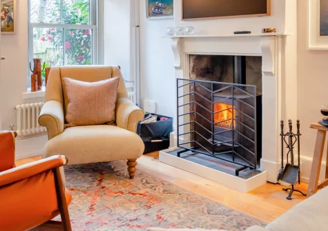 The Old Workshop, Newlyn is a gorgeous stone-built cottage with outstanding sea views to St Michael's Mount, featuring charming coastal interiors, a cosy wood burner, and secluded gardens perfect for exploring beautiful West Cornwall.