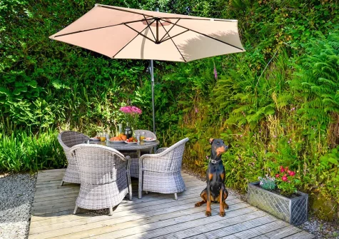 The patio, alfresco dining area & garden at The Orangerie, Gilbert's Coombe