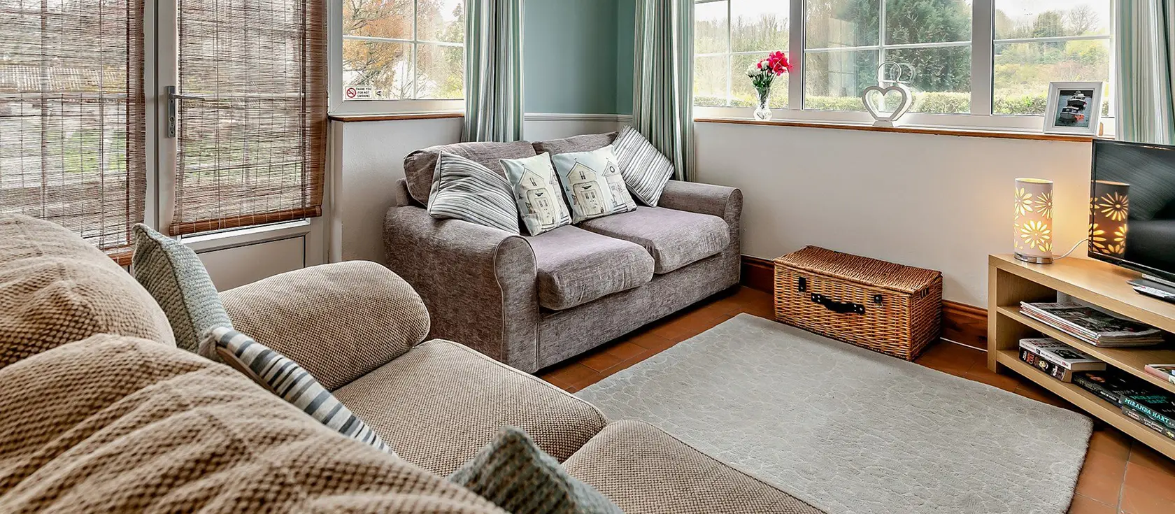 The Orangerie, Gilbert's Coombe is a cottage retreat featuring light-filled dual-aspect rooms, a cosy wood burner, and multiple outdoor spaces. This Cornish hideaway offers easy access to coastal paths, sandy beaches, and historic mining trails.