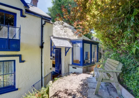 The private pebbled patio & outdoor sitting area at The Orangery, Lynton Cottage, Lynton