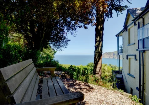 The private pebbled patio & outdoor sitting area at The Orangery, Lynton Cottage, Lynton