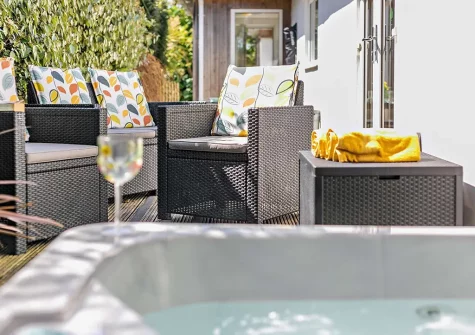 The outdoor sitting area & hot tub at The Palms, Newquay