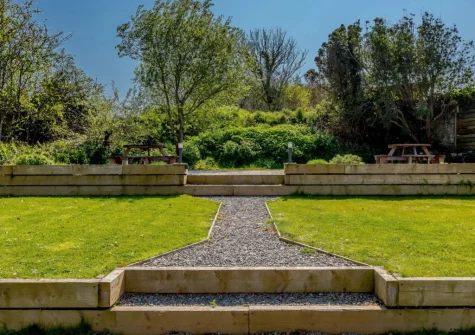 The shared garden, patio, barbecue & alfresco dining area at The Penthouse Larkrise, Mortehoe