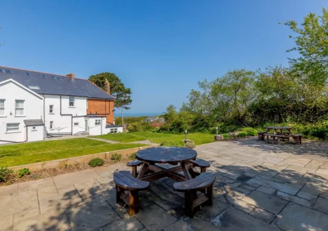 The shared patio, barbecue & alfresco dining area at The Penthouse Larkrise, Mortehoe
