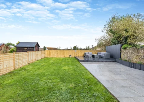The decked patio, outdoor sitting area & enclosed garden at The Pidgeon Nest, Axmouth