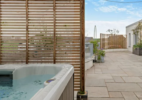 The patio & hot tub at The Piggery, High Bickington