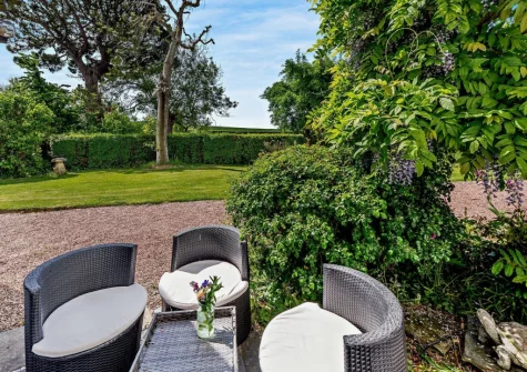 The outdoor sitting area & beautifully manicued garden at The Pines, Eastleigh