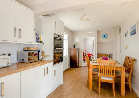 The kitchen & dining area at The Pink Beach Bungalow, Paignton
