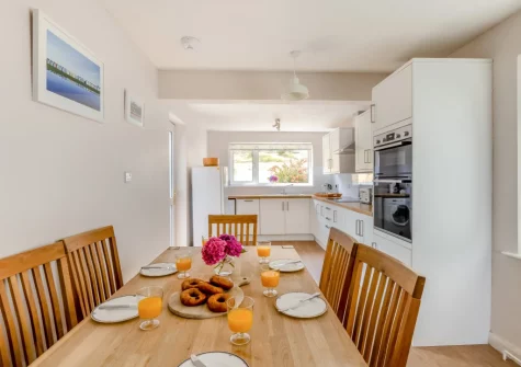 The kitchen & dining area at The Pink Beach Bungalow, Paignton