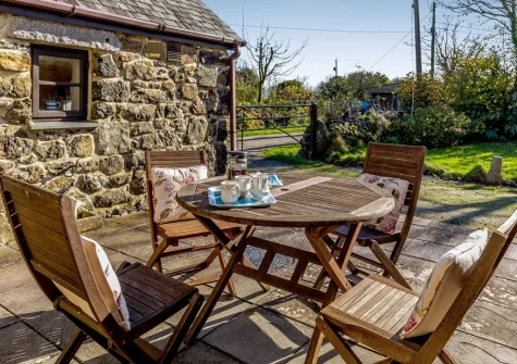 The patio & alfresco dining area at The Rest Barn, Trewillis Farm, Coverack