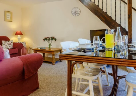 The Rest Barn, Trewillis Farm, Coverack is a beautifully converted barn on a working cattle farm near Coverack's sandy beach, featuring cosy beamed interiors, a private patio for alfresco dining, and 150 acres of peaceful farmland to explore.